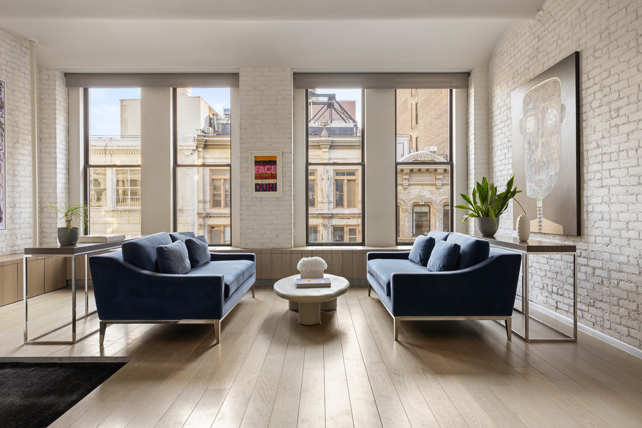 543 Broadway, Unit 6 Manhattan, NY 10012 - Photo 2 of 13 a living room with furniture and a large window