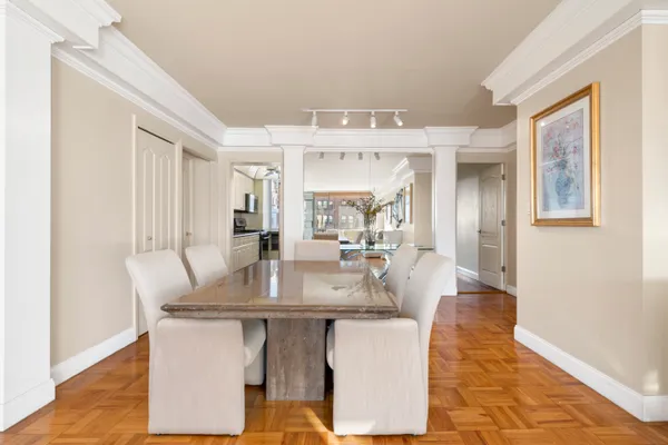 a dining room with table and chairs