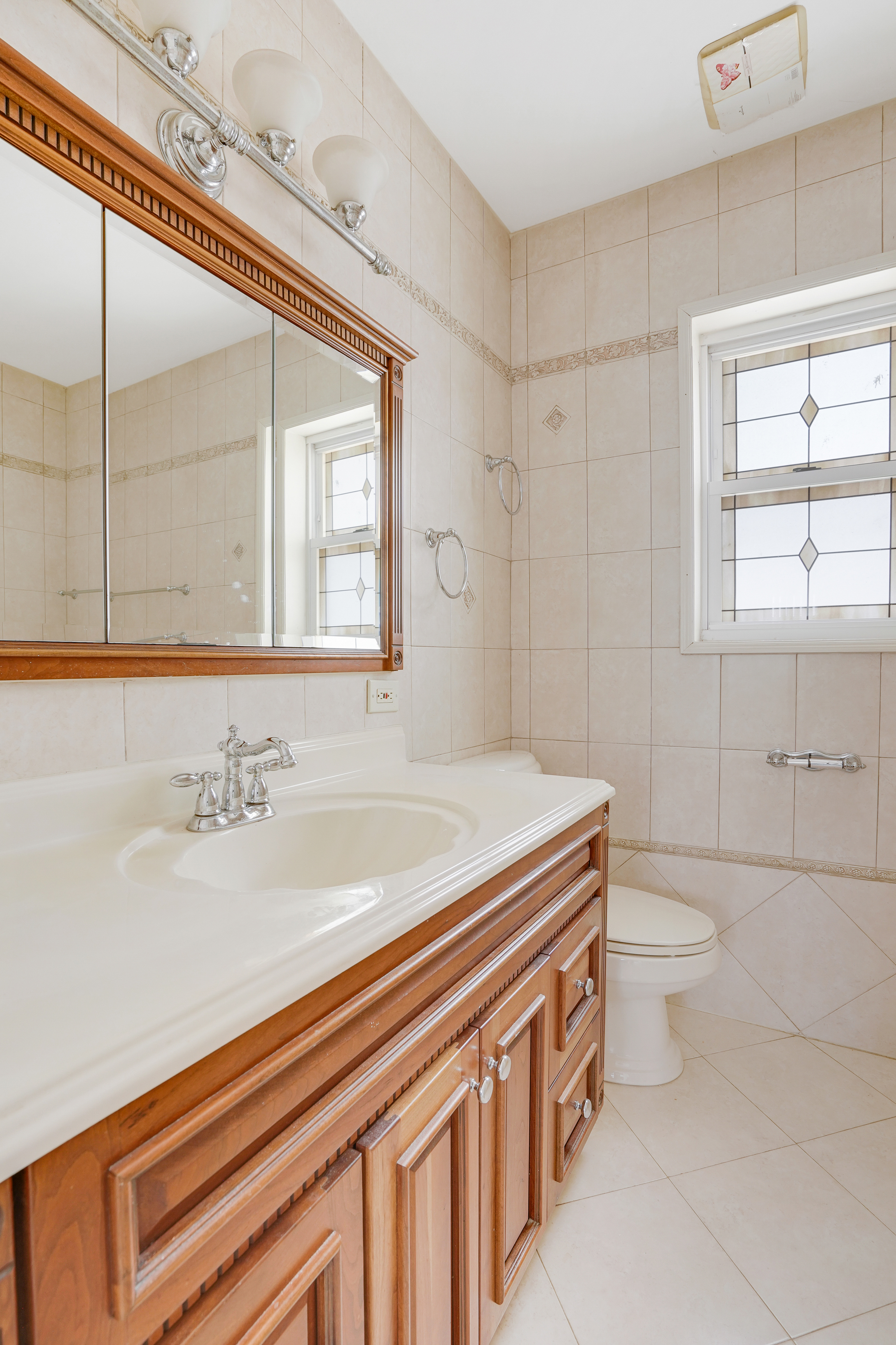 8028 Harbor View Terrace Brooklyn, NY 11209 - Photo 7 of 16 a bathroom with a sink a toilet and a bathtub