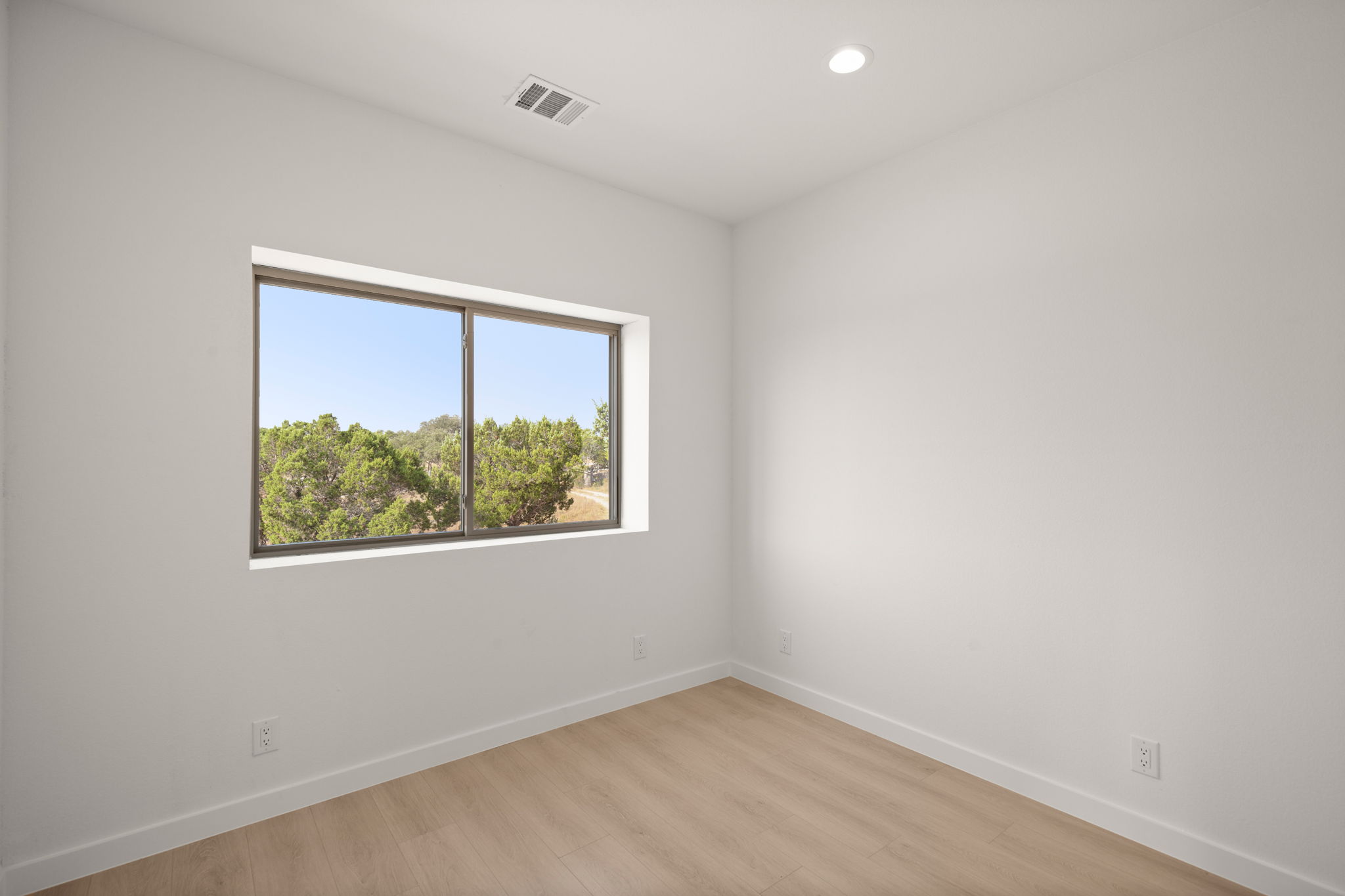 10020 Darden Hill Road, Unit 401 Austin, TX 78737 - Photo 25 of 50 an empty room with a window