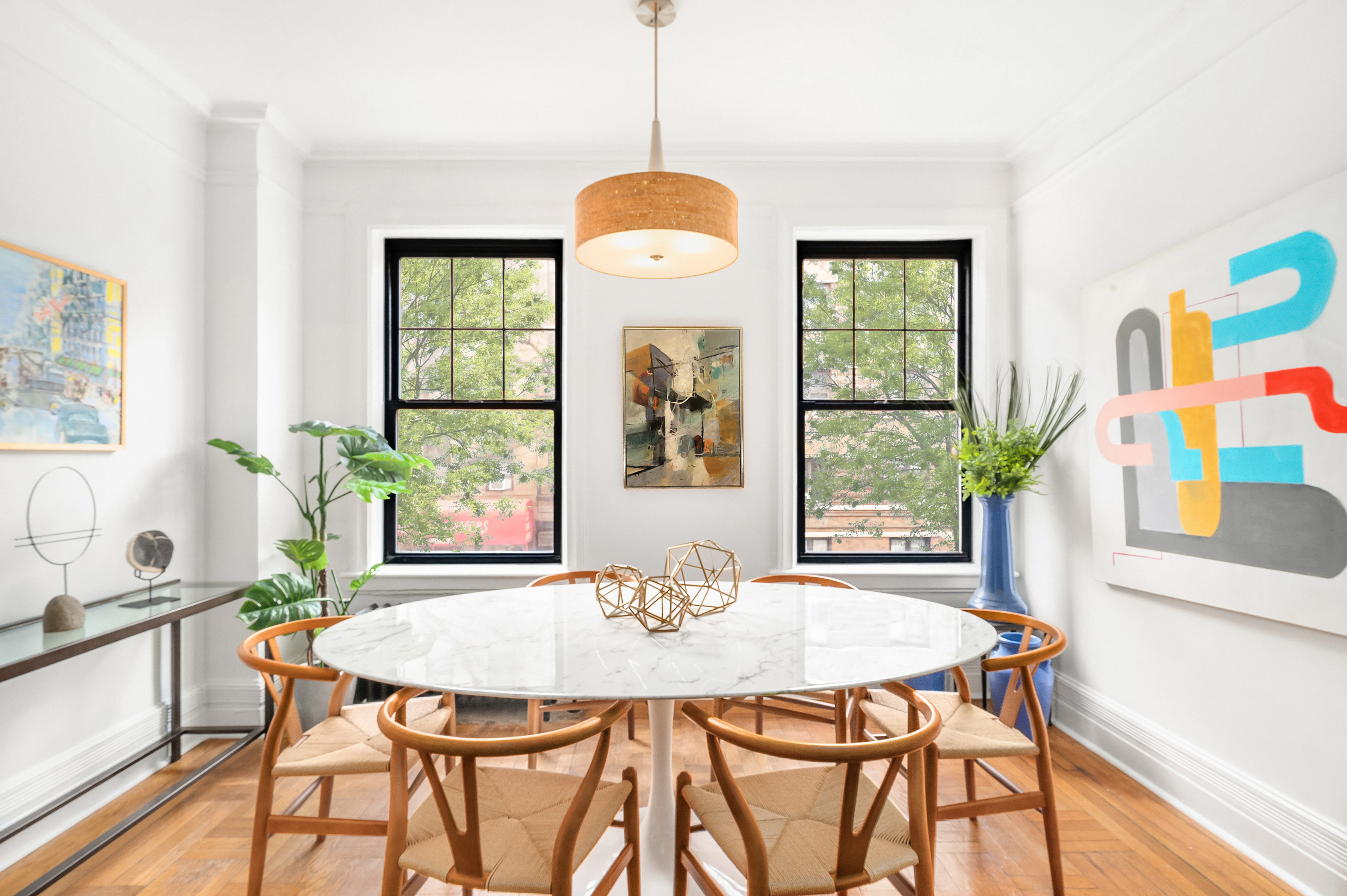 170 2nd Avenue, Unit 2D Manhattan, NY 10003 - Photo 2 of 11 a dining room with furniture a window and a chandelier