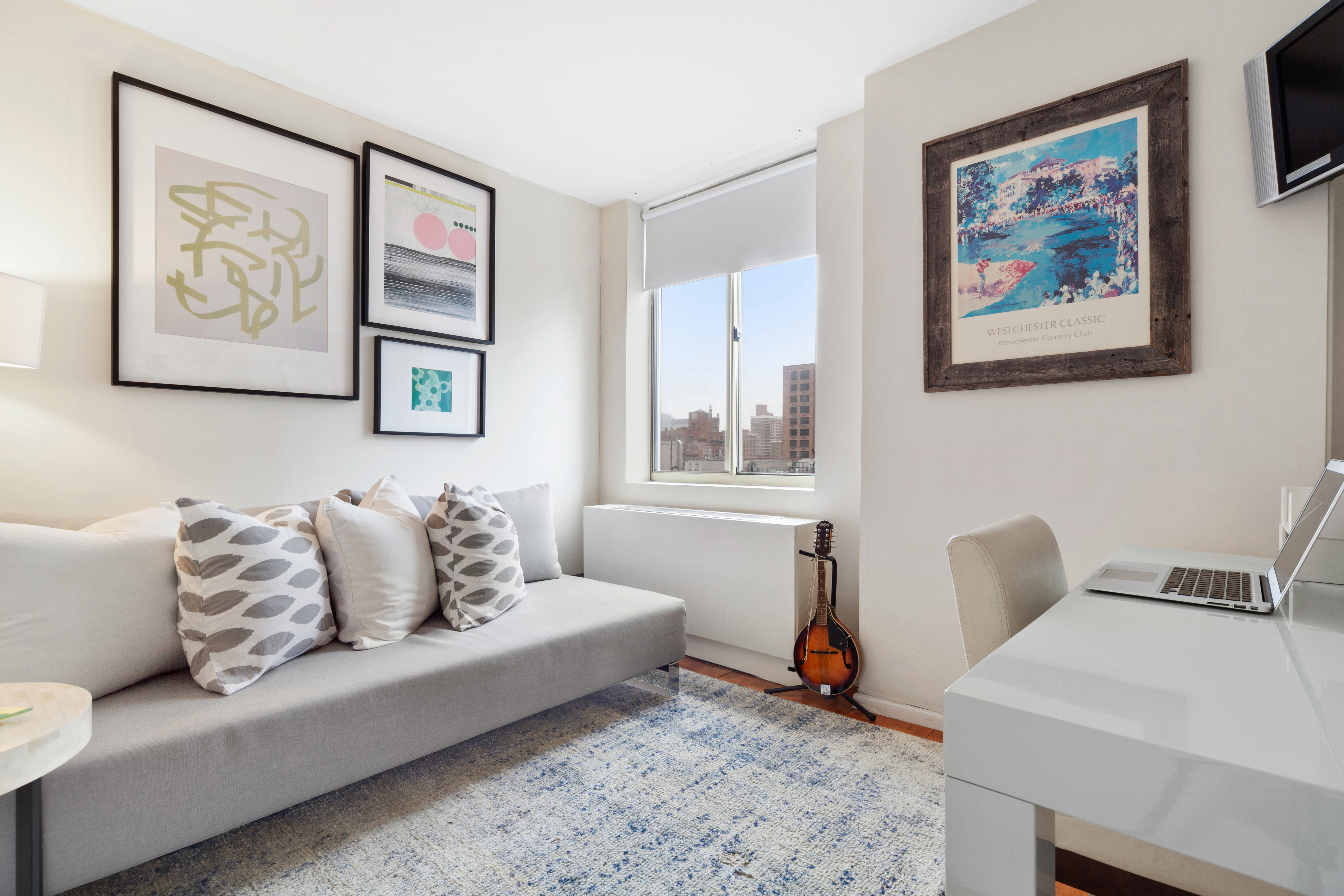 50 Lexington Avenue, Unit 18D Manhattan, NY 10010 - Photo 4 of 12 a living room with furniture and a window