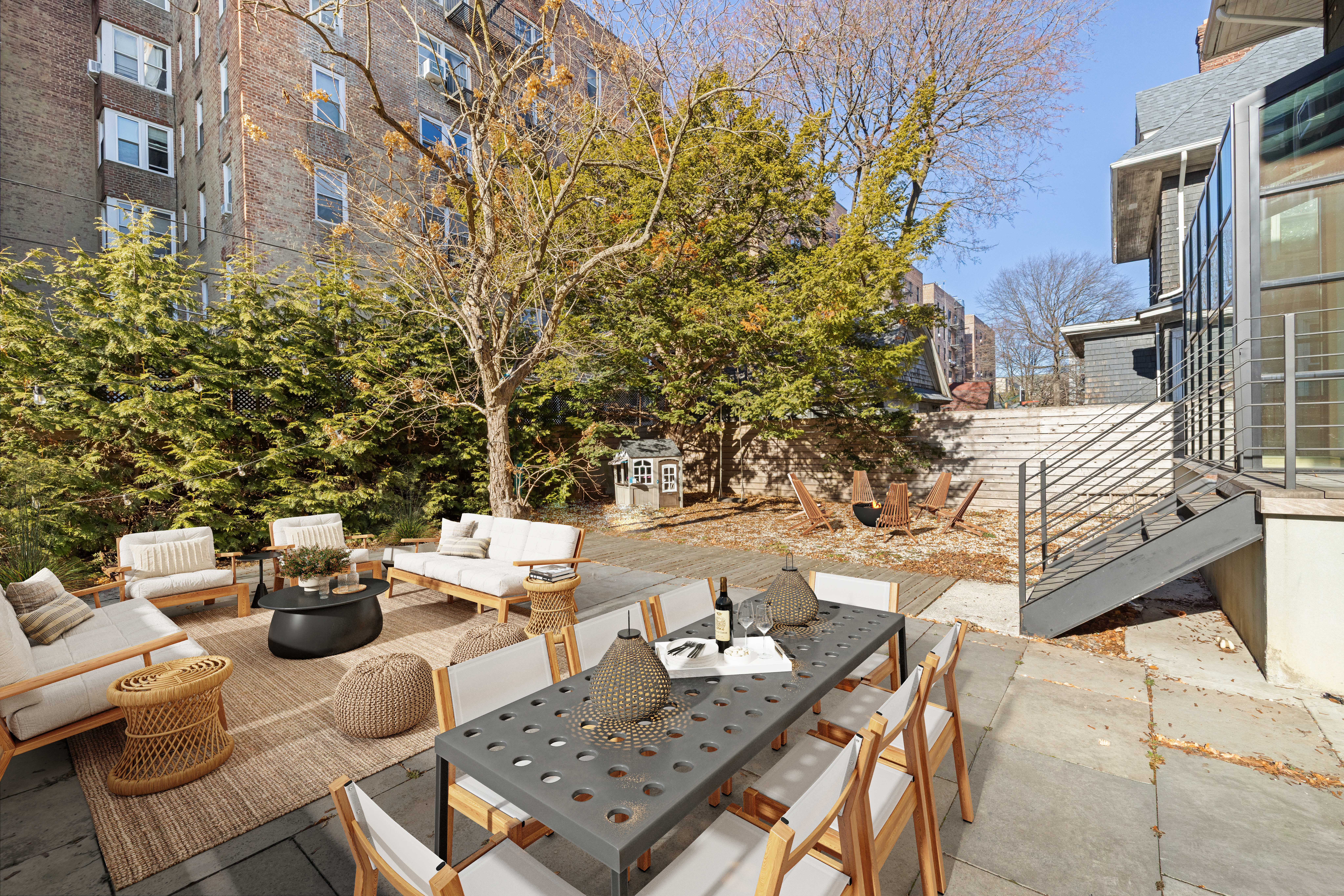 792 East 21st Street Brooklyn, NY 11210 - Photo 26 of 29 a view of a patio with couches and table and chairs and potted plants