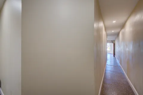 a view of a bathroom from a hallway