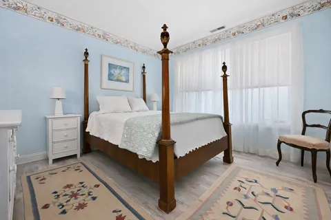 a living room with furniture and a book shelf