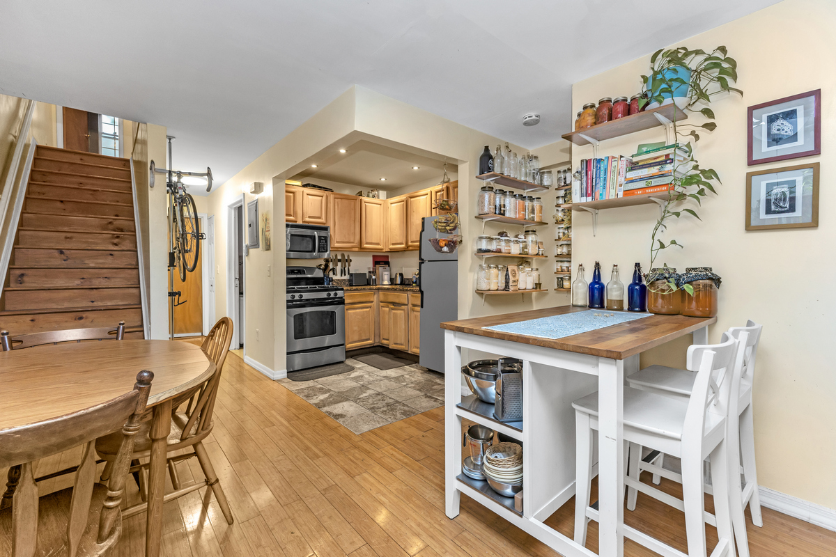 539 Quincy Street Brooklyn, NY 11221 - Photo 4 of 15 a kitchen with stainless steel appliances granite countertop a stove and a refrigerator