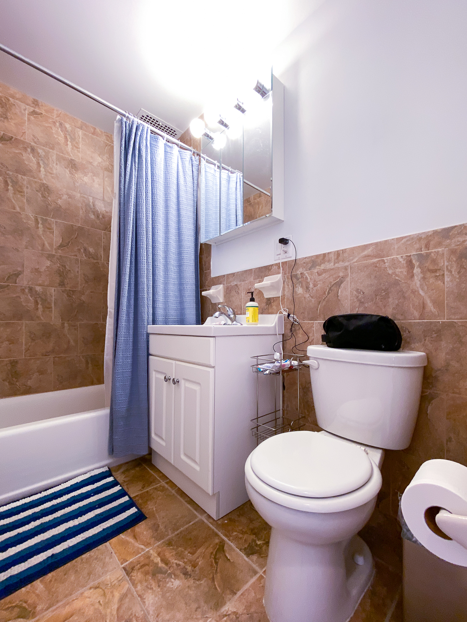 238 West 20th Street, Unit 5B Manhattan, NY 10011 - Photo 4 of 12 a bathroom with a toilet a sink and a bathtub