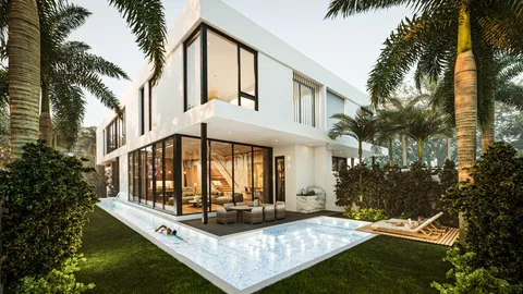 a view of a house with backyard and sitting area