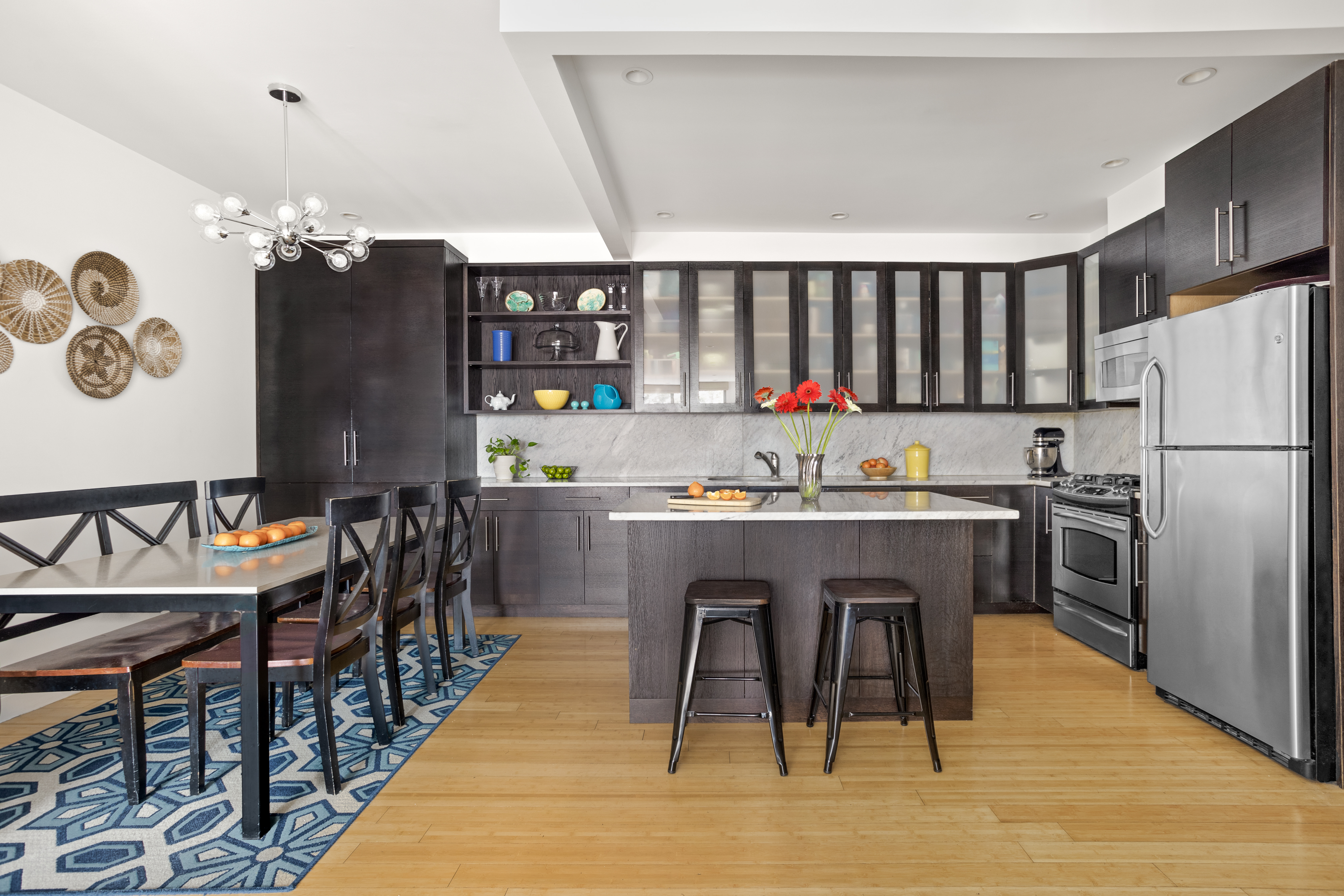 35 McDonald Avenue, Unit 2B Brooklyn, NY 11218 - Photo 4 of 10 a kitchen with a refrigerator a stove a sink and chairs
