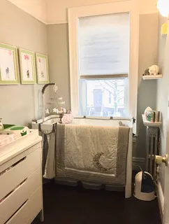 a bedroom with a bed and a ceiling fan