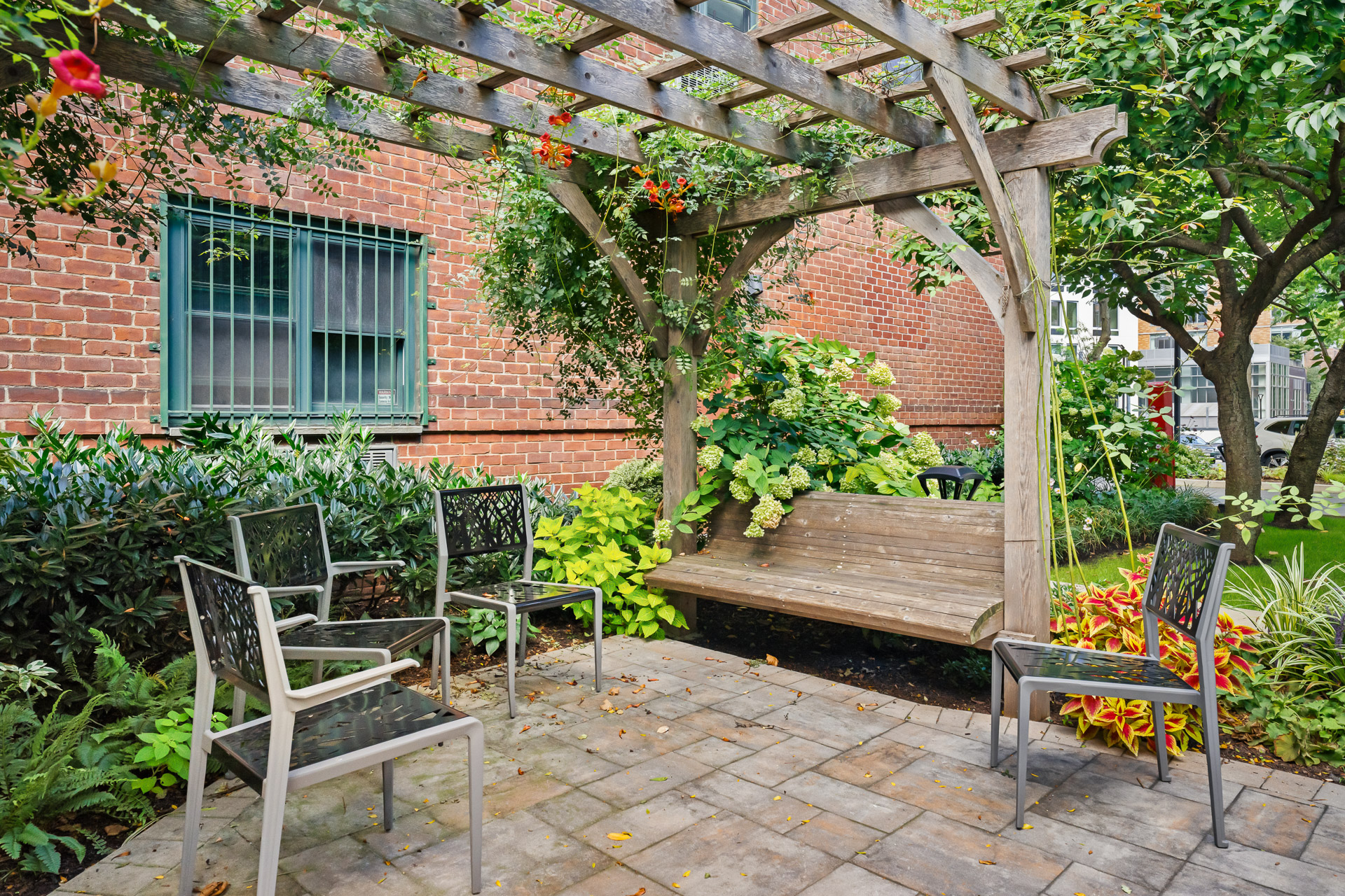 191 Willoughby Street, Unit 6N Brooklyn, NY 11201 - Photo 15 of 17 a view of an chair and table in the back yard of the house