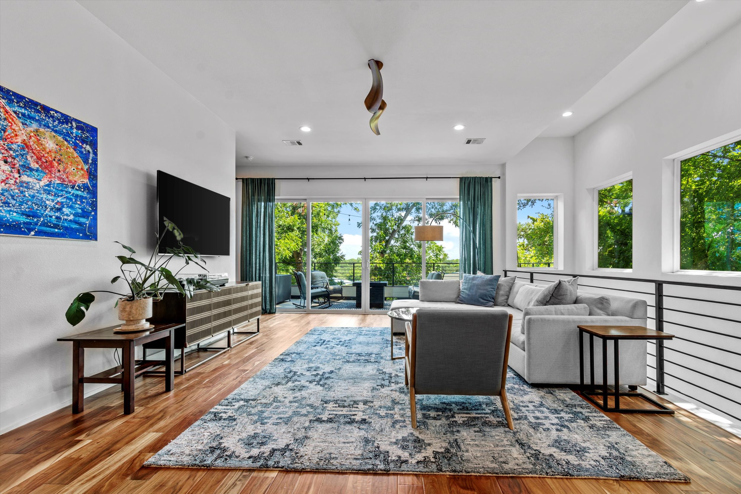 2712 Oak Springs Drive, Unit A Austin, TX 78702 - Photo 3 of 38 a living room with furniture and a flat screen tv