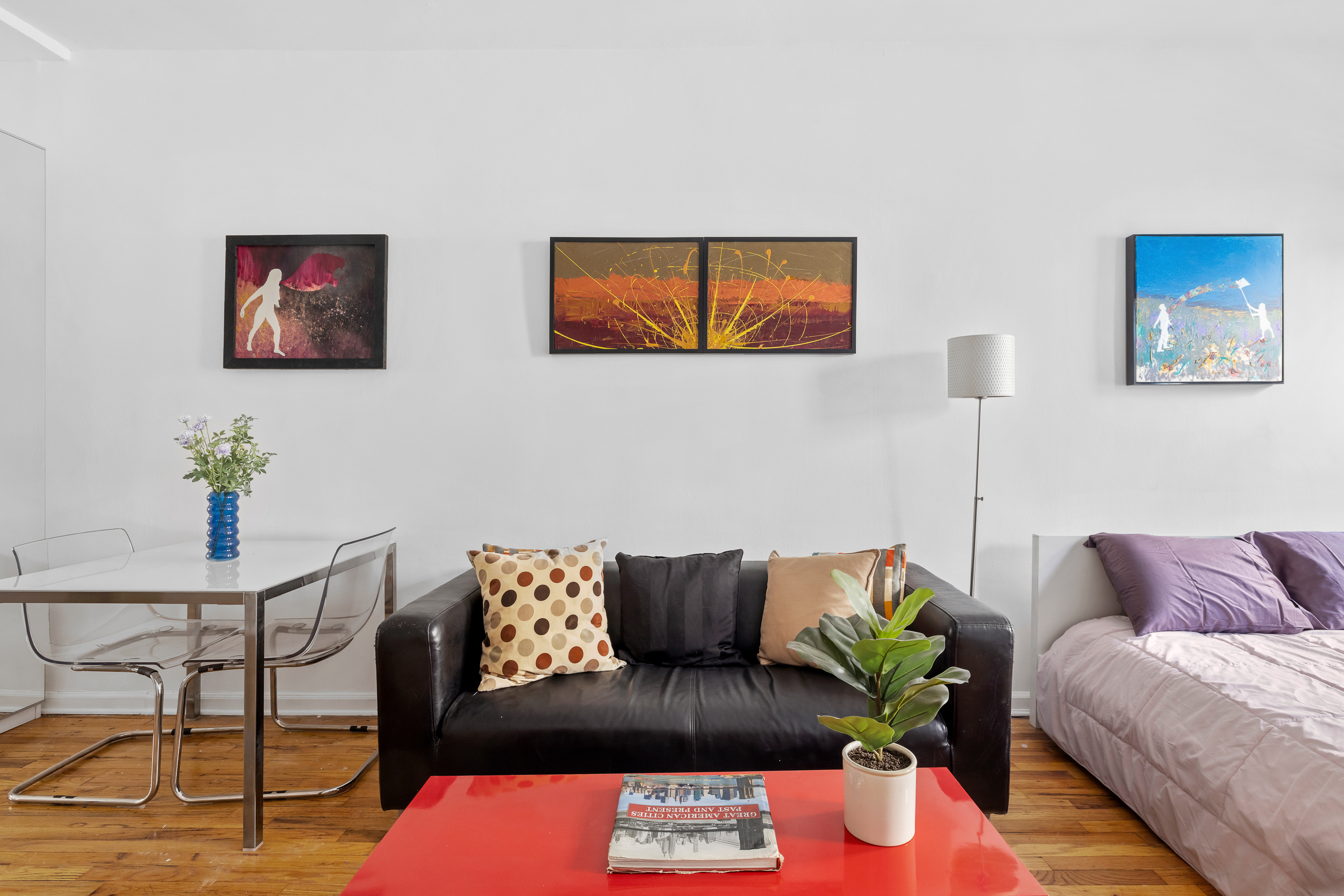 205 East 89th Street, Unit C4 Manhattan, NY 10128 - Photo 3 of 7 a living room with furniture and a potted plant