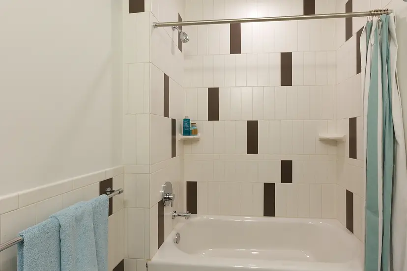 22 Caton Place, Unit 6DD Brooklyn, NY 11218 - Photo 5 of 16 a bathroom with a white bath tub