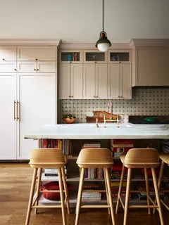 a dinning table and chairs in a kitchen