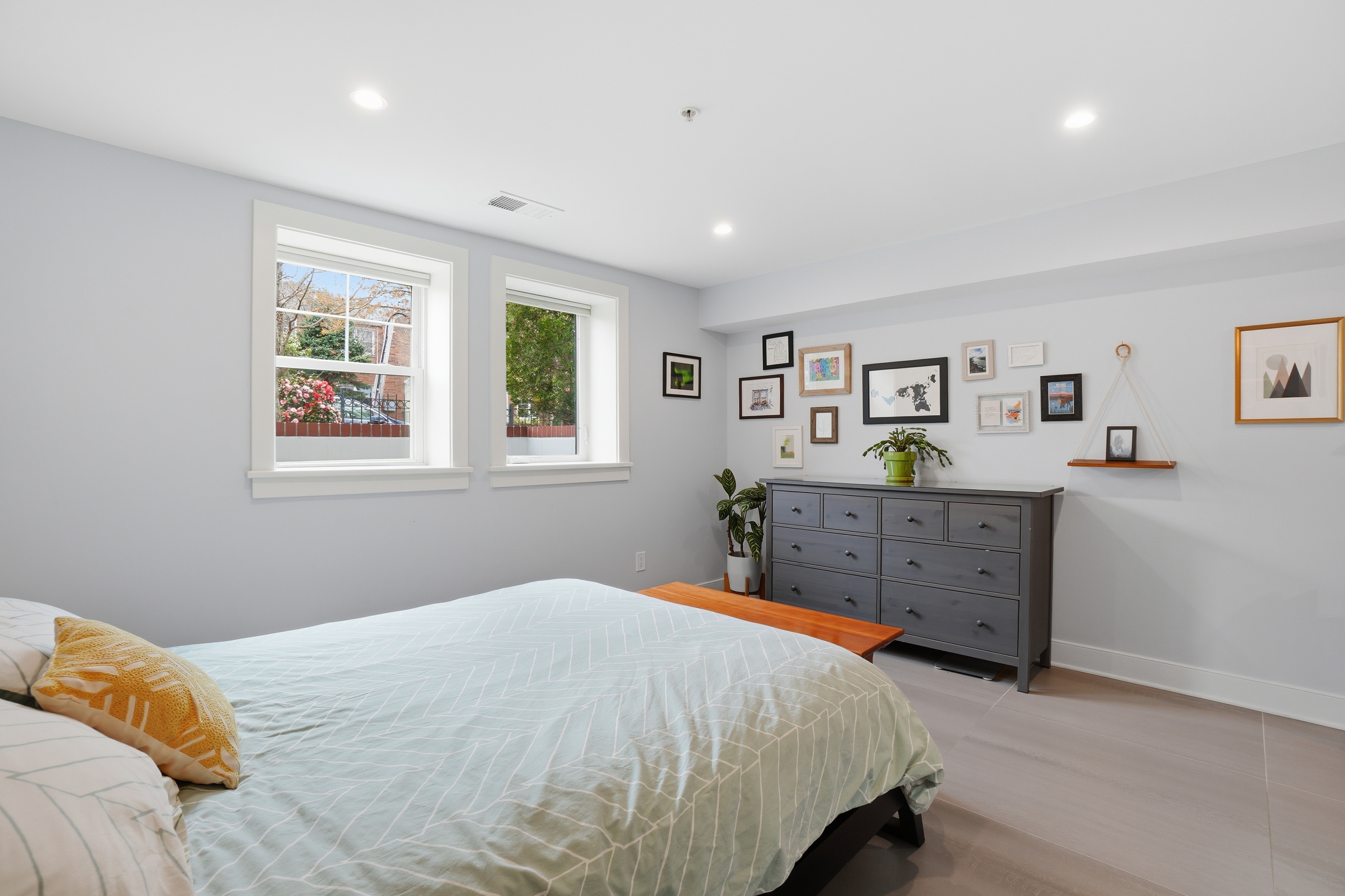 1244 Raum Street Northeast, Unit 5 Washington, DC 20002 - Photo 12 of 21 a bedroom with a bed and painting on the wall