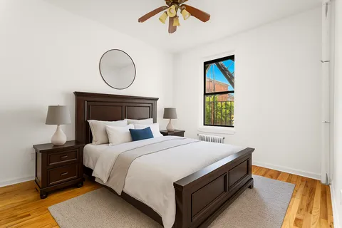 a bedroom with a bed and window