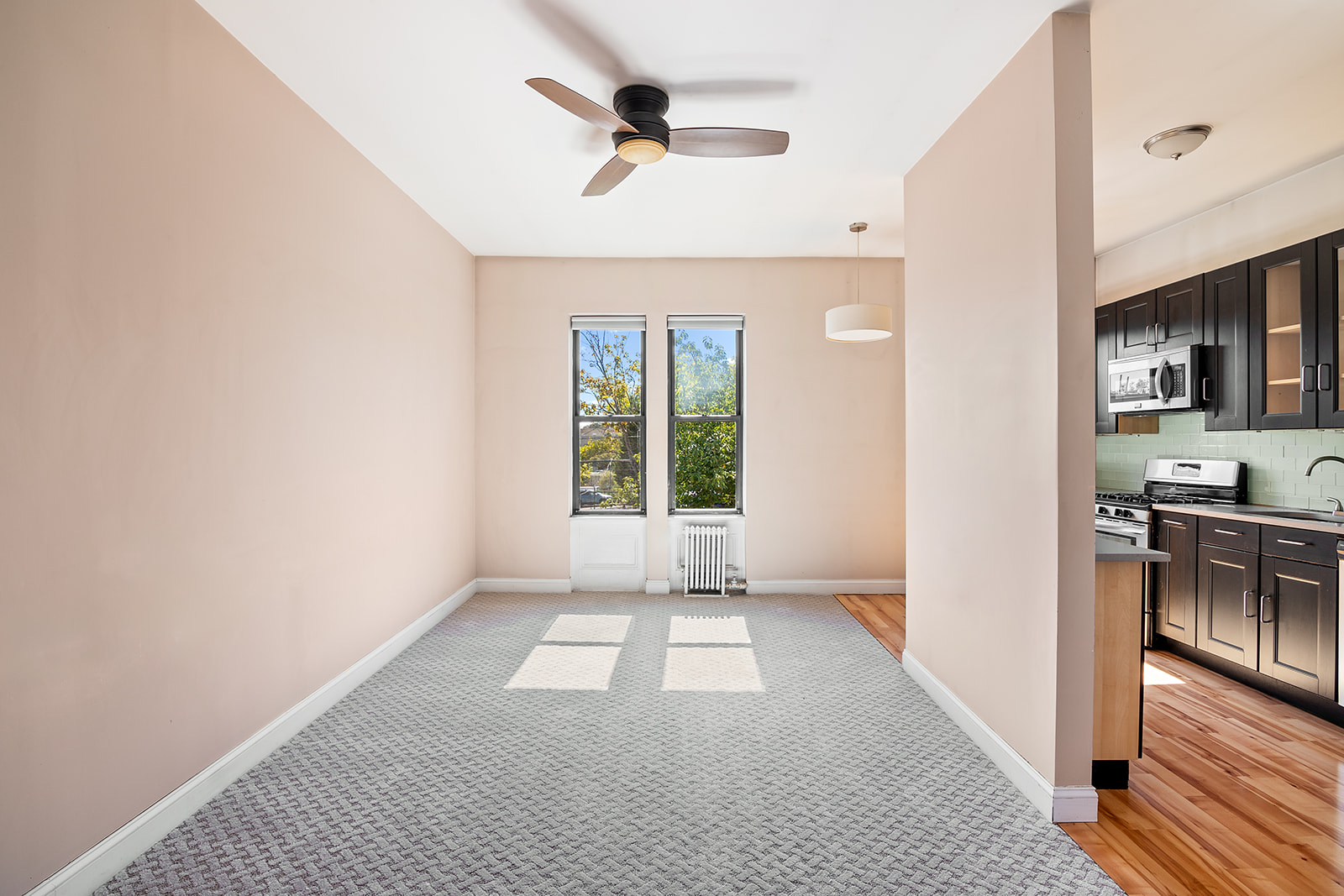 512 17th Street Brooklyn, NY 11215 - Photo 9 of 14 a view of empty room with wooden floor and fan