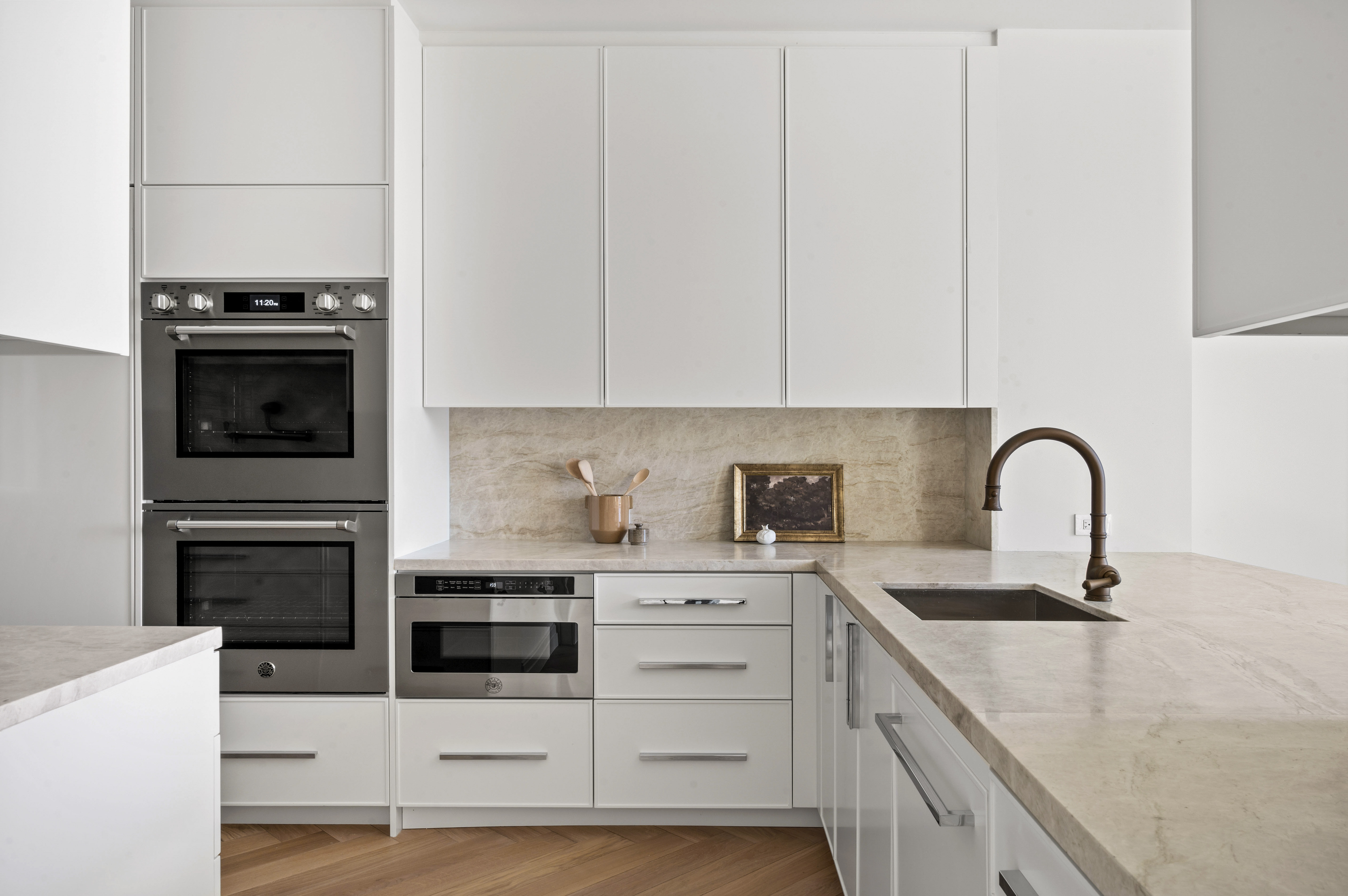 15 West 96th Street, Unit 10 Manhattan, NY 10025 - Photo 3 of 20 a kitchen with stainless steel appliances kitchen island a white stove top oven and sink