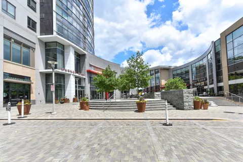 a view of a building with sitting area