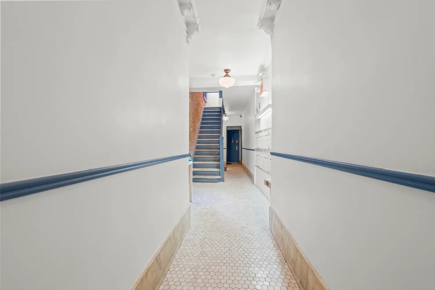 a view of a hallway with stairs