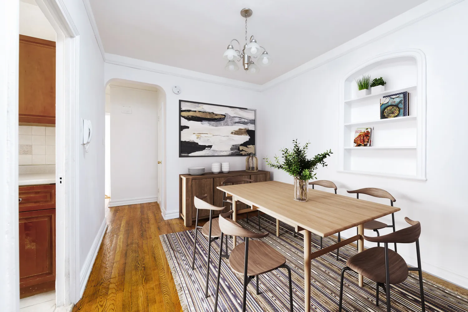 a view of a dining room with furniture and wooden floor