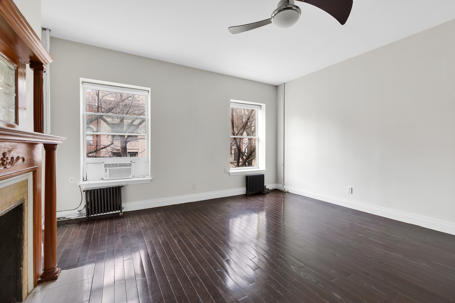 25 Hamilton Terrace, Unit 3F Manhattan, NY 10031 - Photo 3 of 6 wooden floor in an empty room with a window
