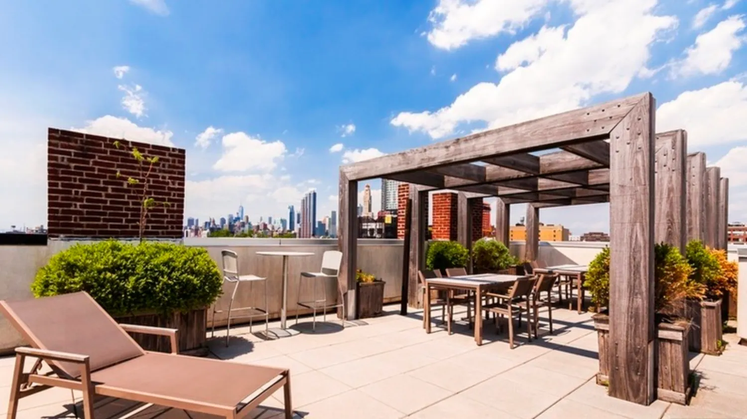 a view of a patio with table and chairs and potted plants