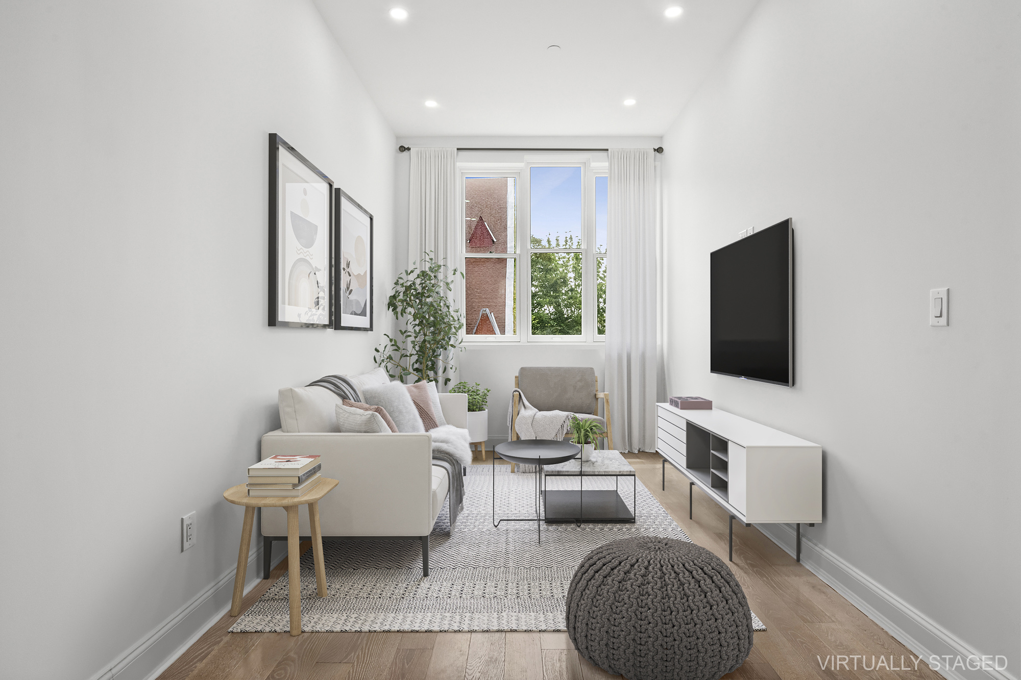 467 Tompkins Avenue, Unit 3A Brooklyn, NY 11216 - Photo 2 of 12 a living room with furniture a rug and a flat screen tv