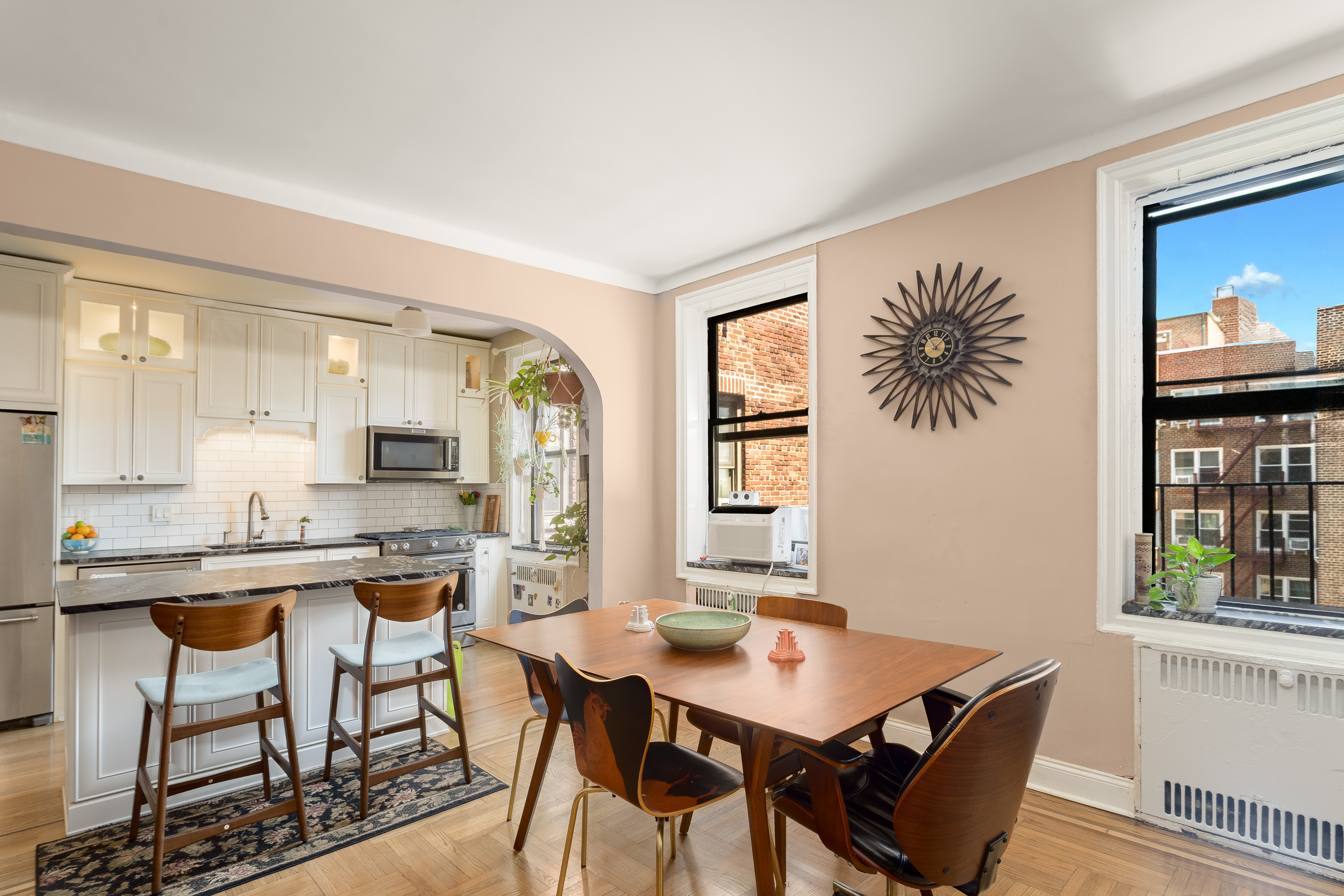 35-06 88th Street, Unit 5DD Queens, NY 11372 - Photo 6 of 18 a view of a dining room with furniture and window
