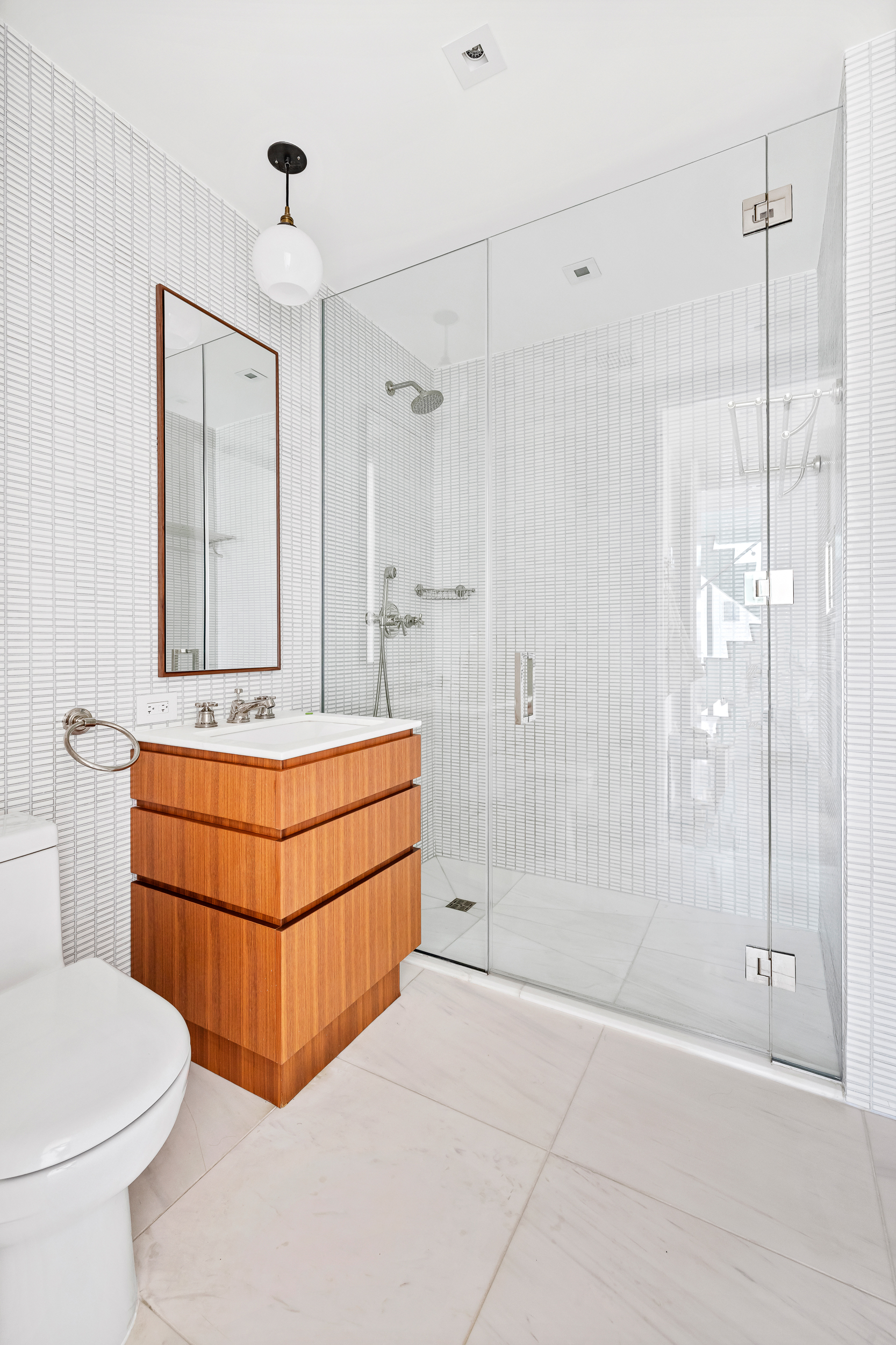 15 Renwick Street, Unit PH2 Manhattan, NY 10013 - Photo 22 of 23 a bathroom with a sink a toilet and shower
