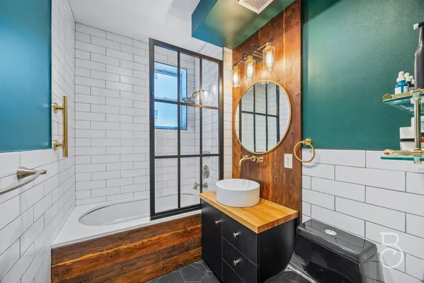 a bathroom with a sink and a mirror