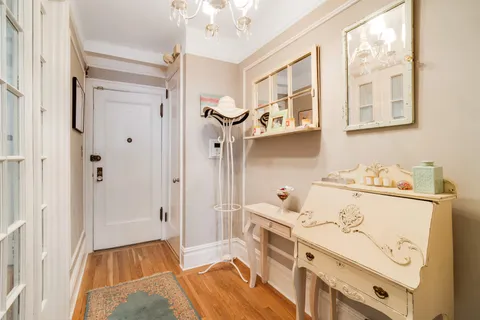 a bedroom with furniture and a wooden floor
