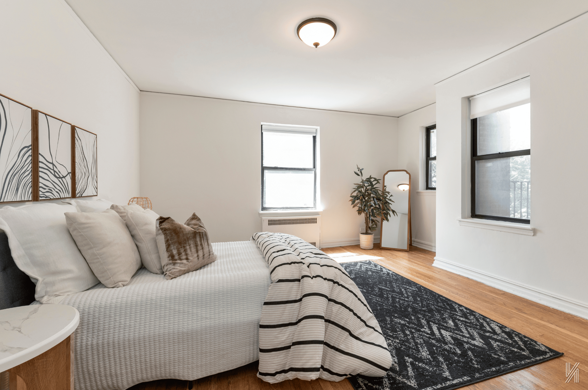 35-35 75th Street, Unit 428 Queens, NY 11372 - Photo 13 of 21 a bedroom with a large bed and a window