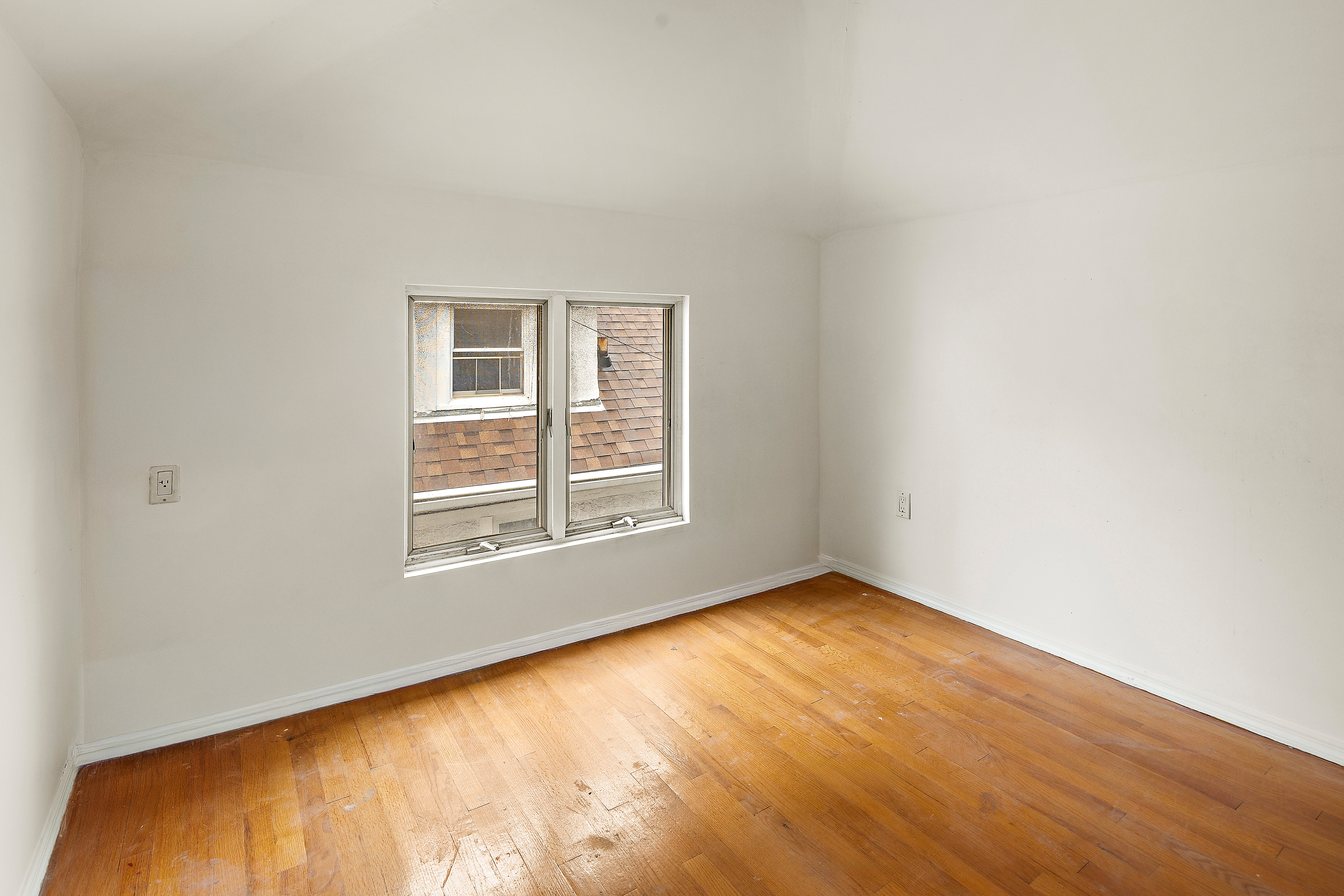 558 84th Street Brooklyn, NY 11209 - Photo 20 of 25 an empty room with a window