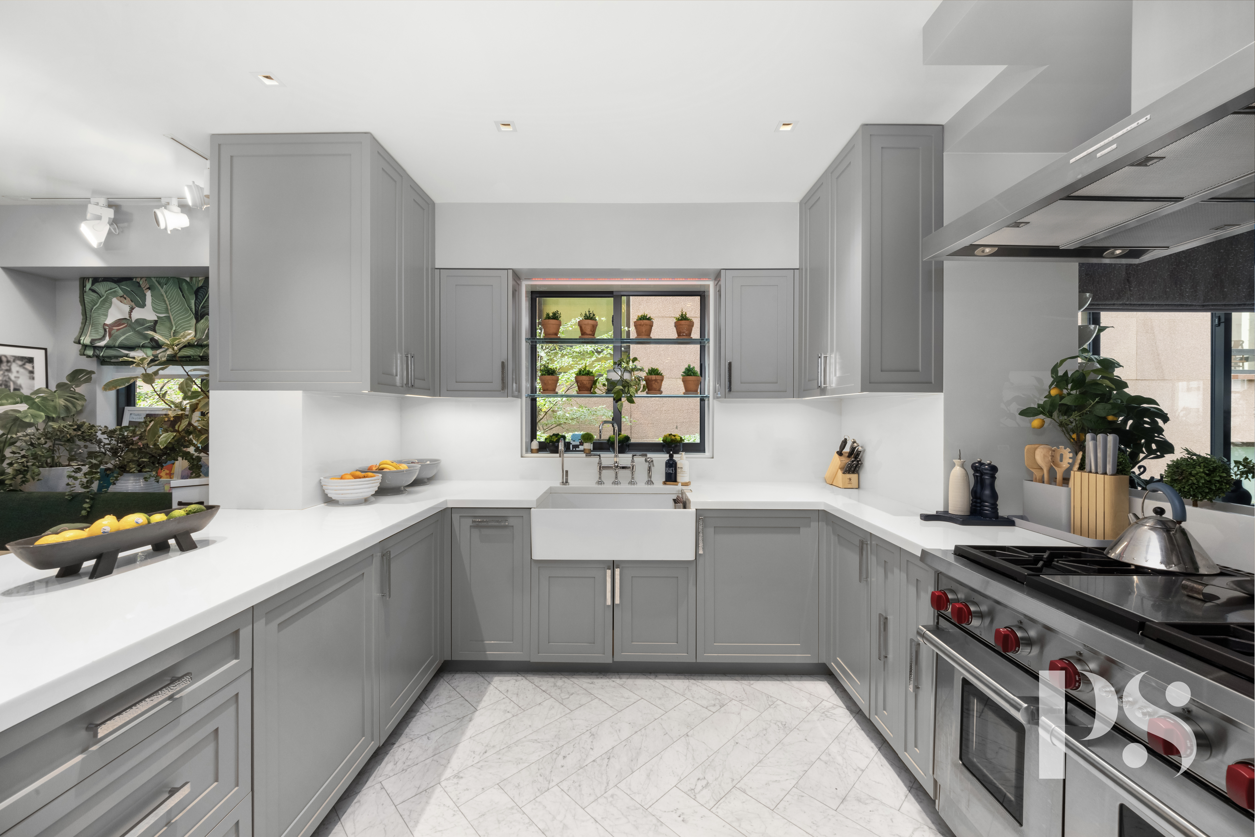 733 Park Avenue, Unit 4 Manhattan, NY 10021 - Photo 9 of 29 a kitchen with a sink a stove and cabinets