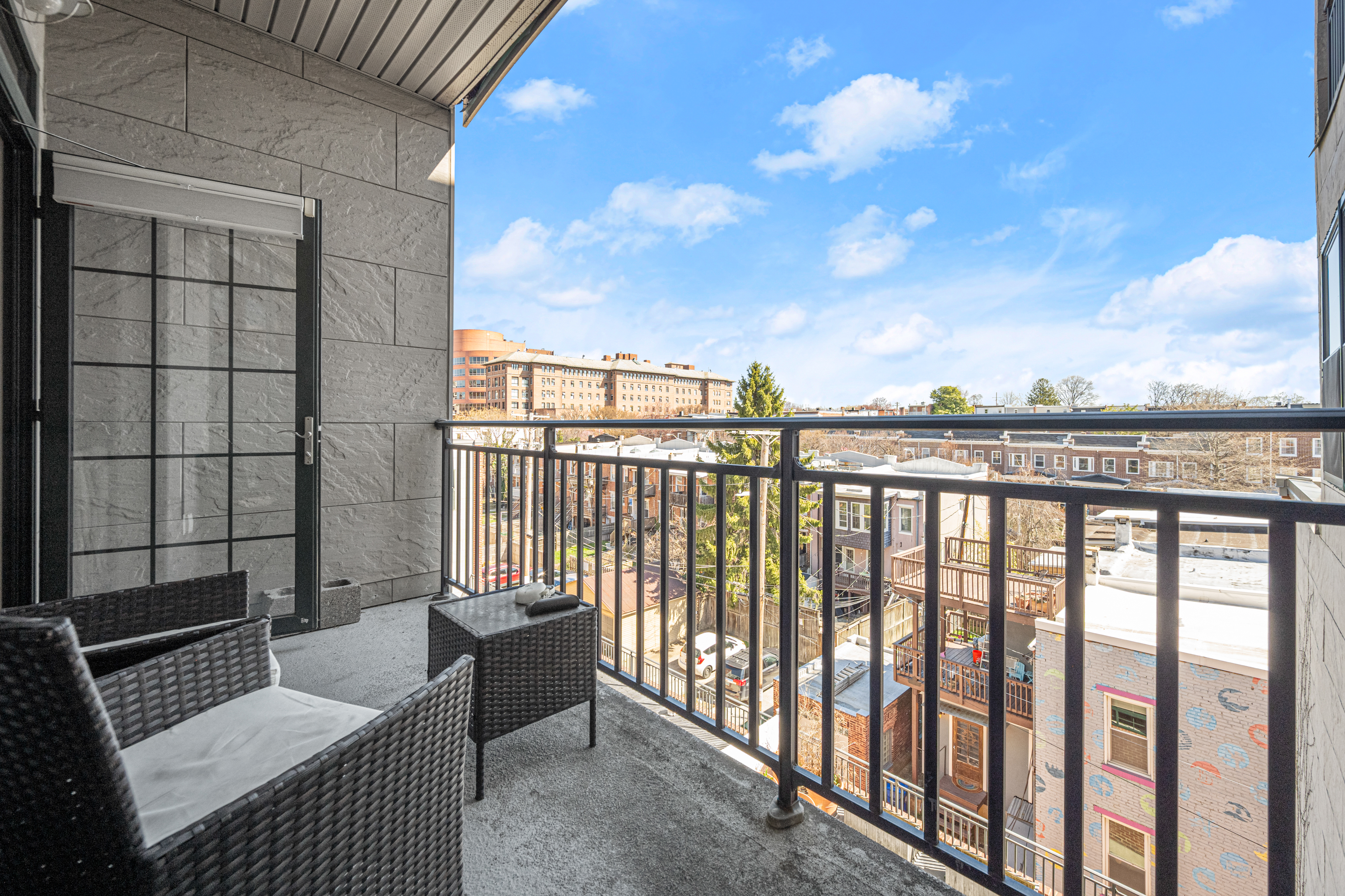 3201 St Paul Street, Unit 310 Baltimore, MD 21218 - Photo 20 of 20 a balcony with wooden floor