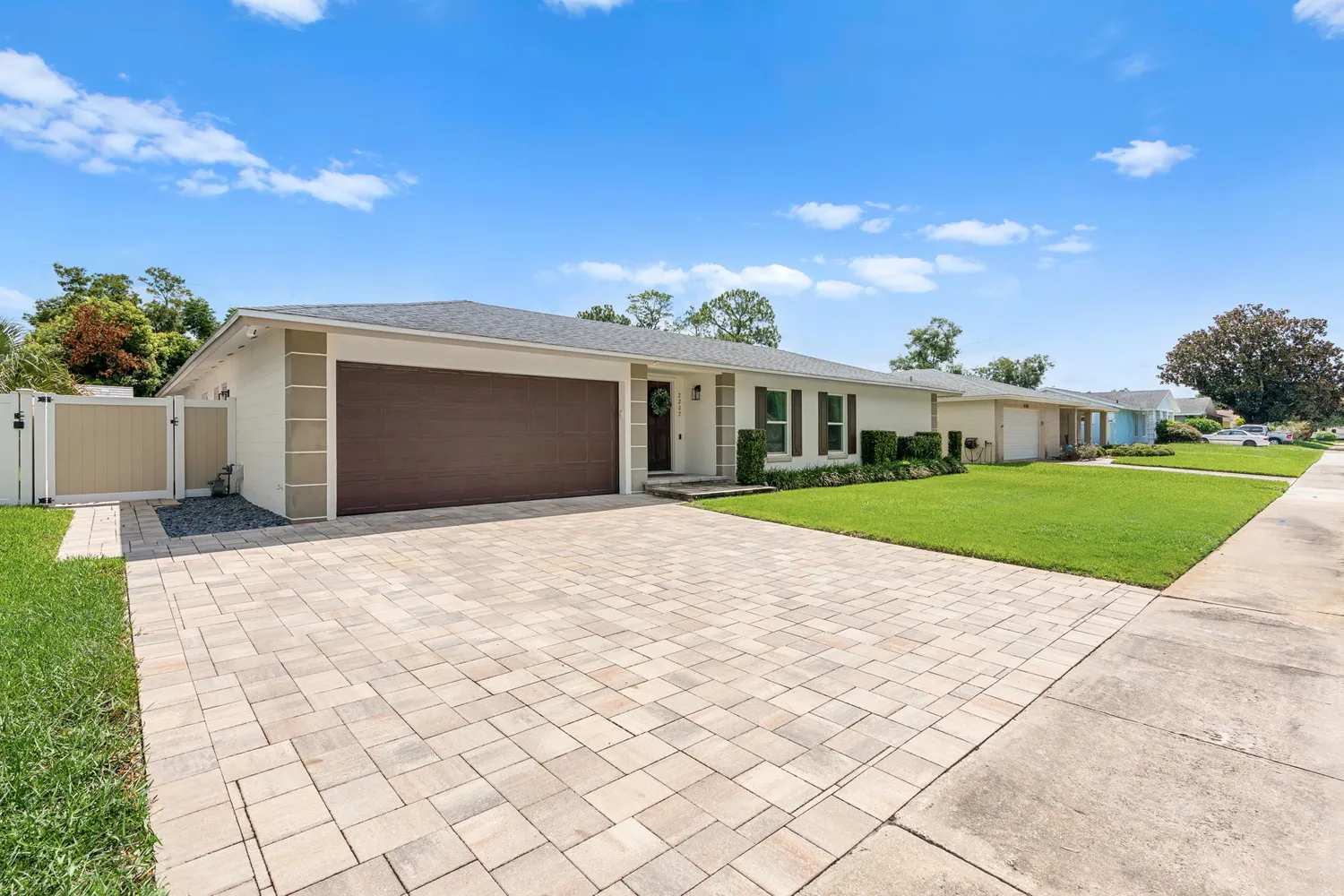 a view of white house with a yard