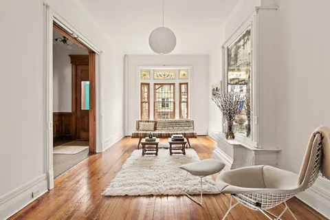 a dining room with furniture and wooden floor
