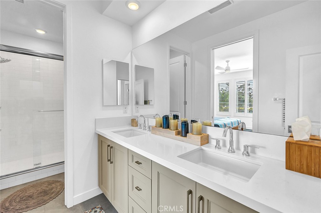 1632 Doheny Way Dana Point, CA 92629 - Photo 15 of 33 a bathroom with double vanity and a mirror