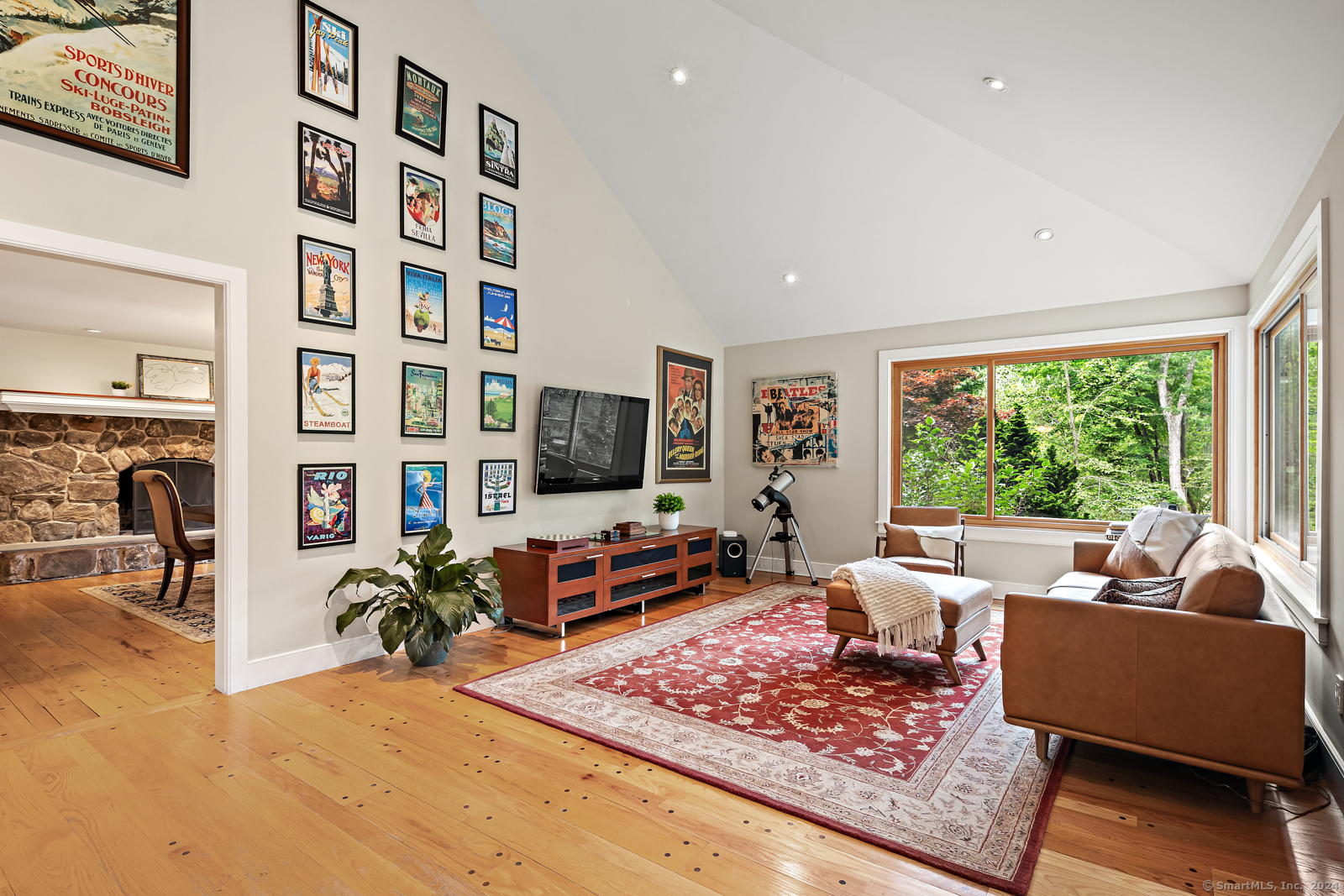 13 Bittersweet Road Weston, CT 06883 - Photo 10 of 35 a living room with fireplace furniture and a flat screen tv