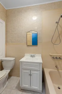 a bathroom with a sink toilet and vanity