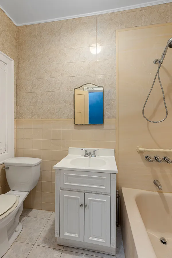 a bathroom with a sink toilet and vanity