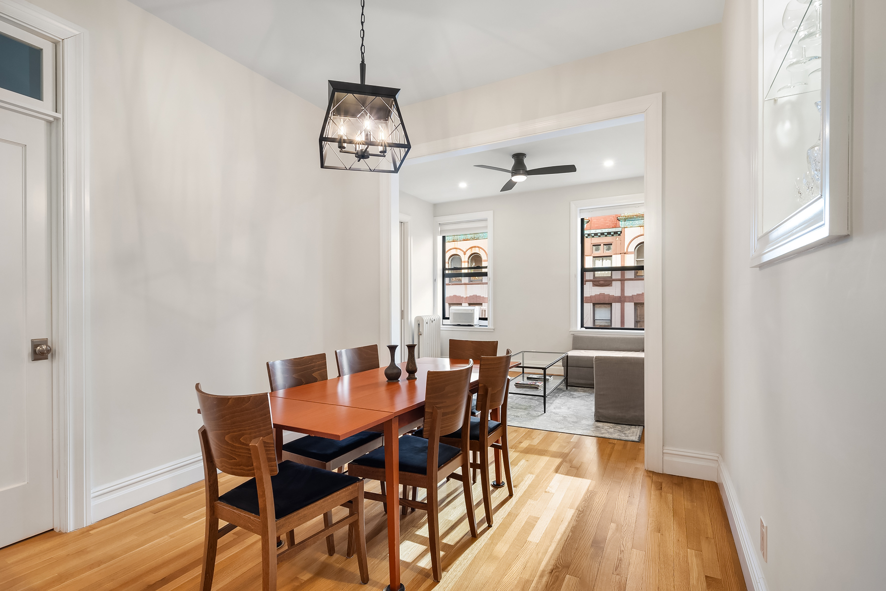 334 West 85th Street, Unit 3A Manhattan, NY 10024 - Photo 1 of 8 a view of a dining room with furniture wooden floor and chandelier