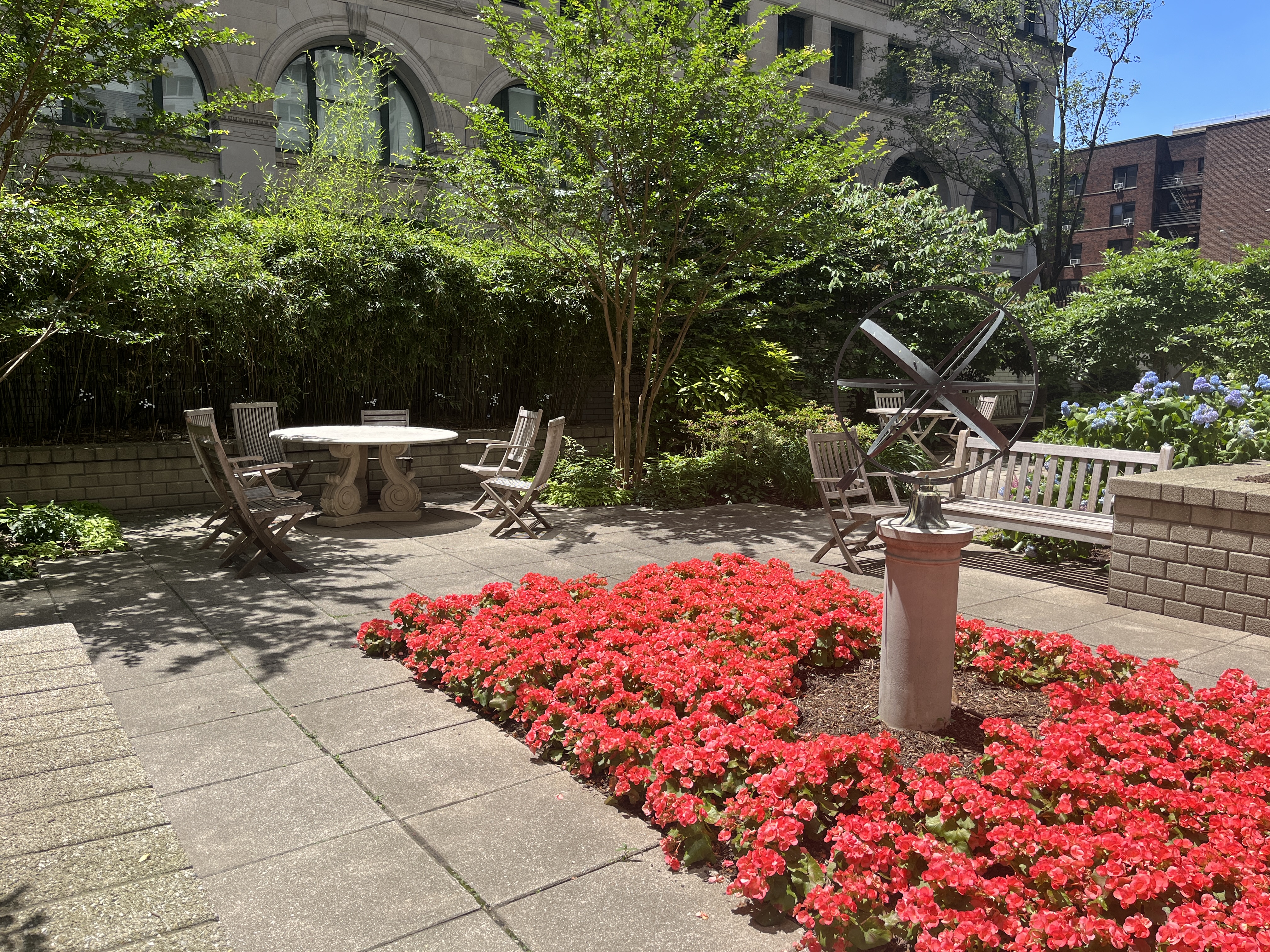 70 East 10th Street, Unit 14M Manhattan, NY 10003 - Photo 16 of 22 a backyard of a house with lots of green space and fountain