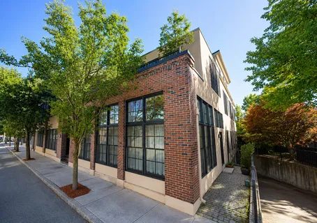 a view of a brick house with a street