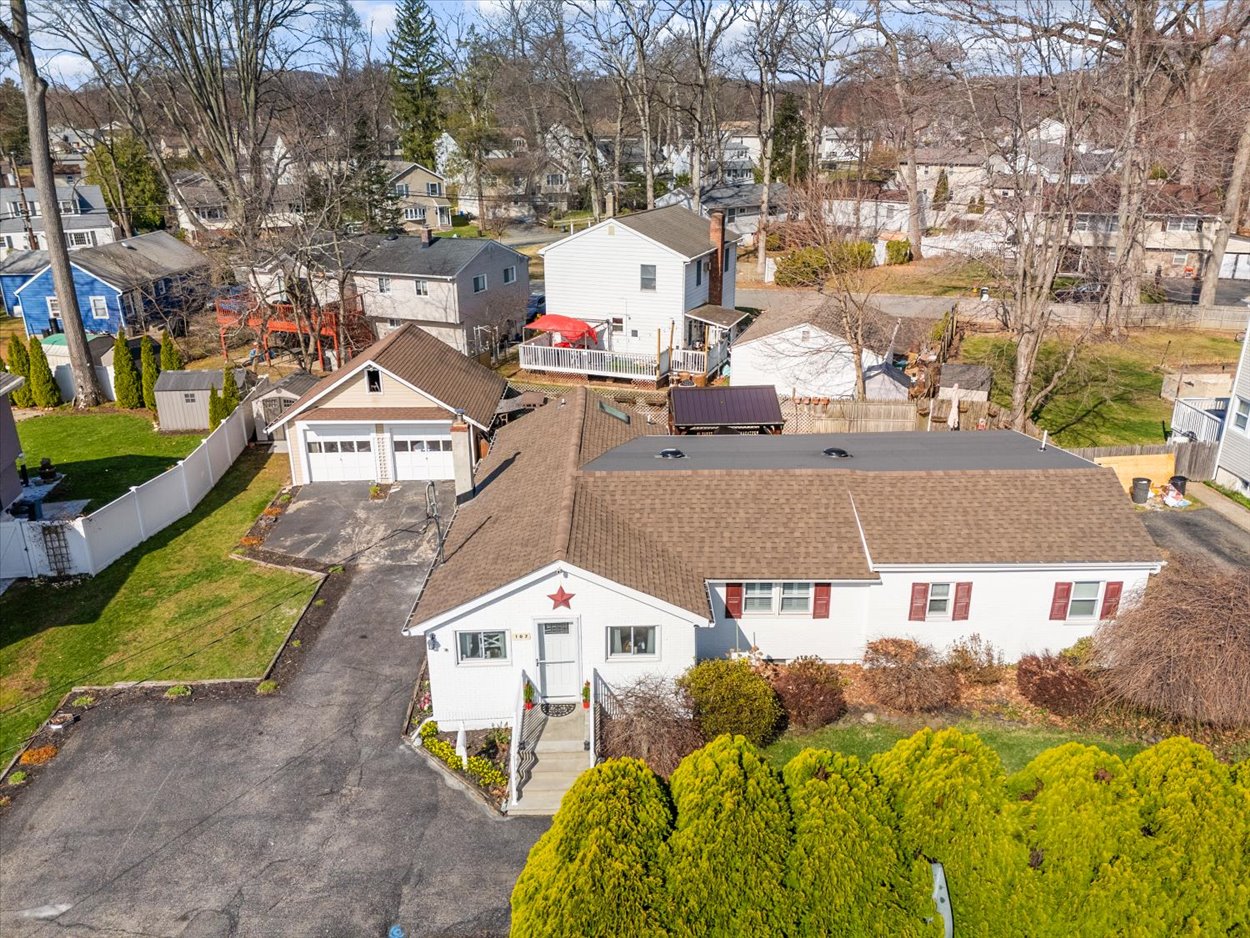 107 Kingston Road Parsippany, NJ 07054 - Photo 2 of 43 a view of multiple houses with a yard