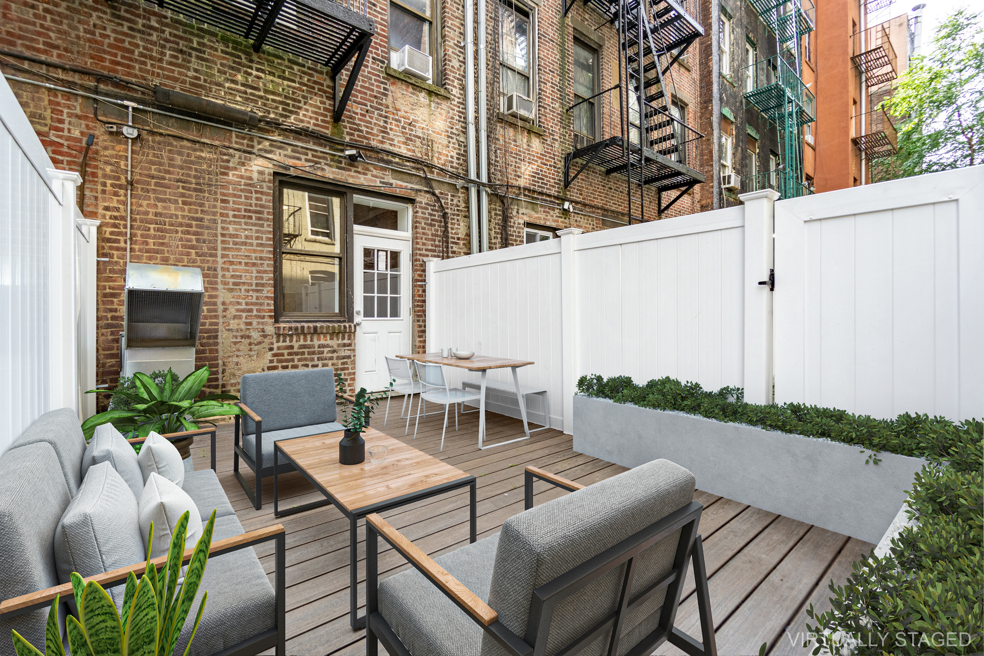 339 East 6th Street, Unit B Manhattan, NY 10003 - Photo 3 of 22 a view of a patio with table and chairs and potted plants