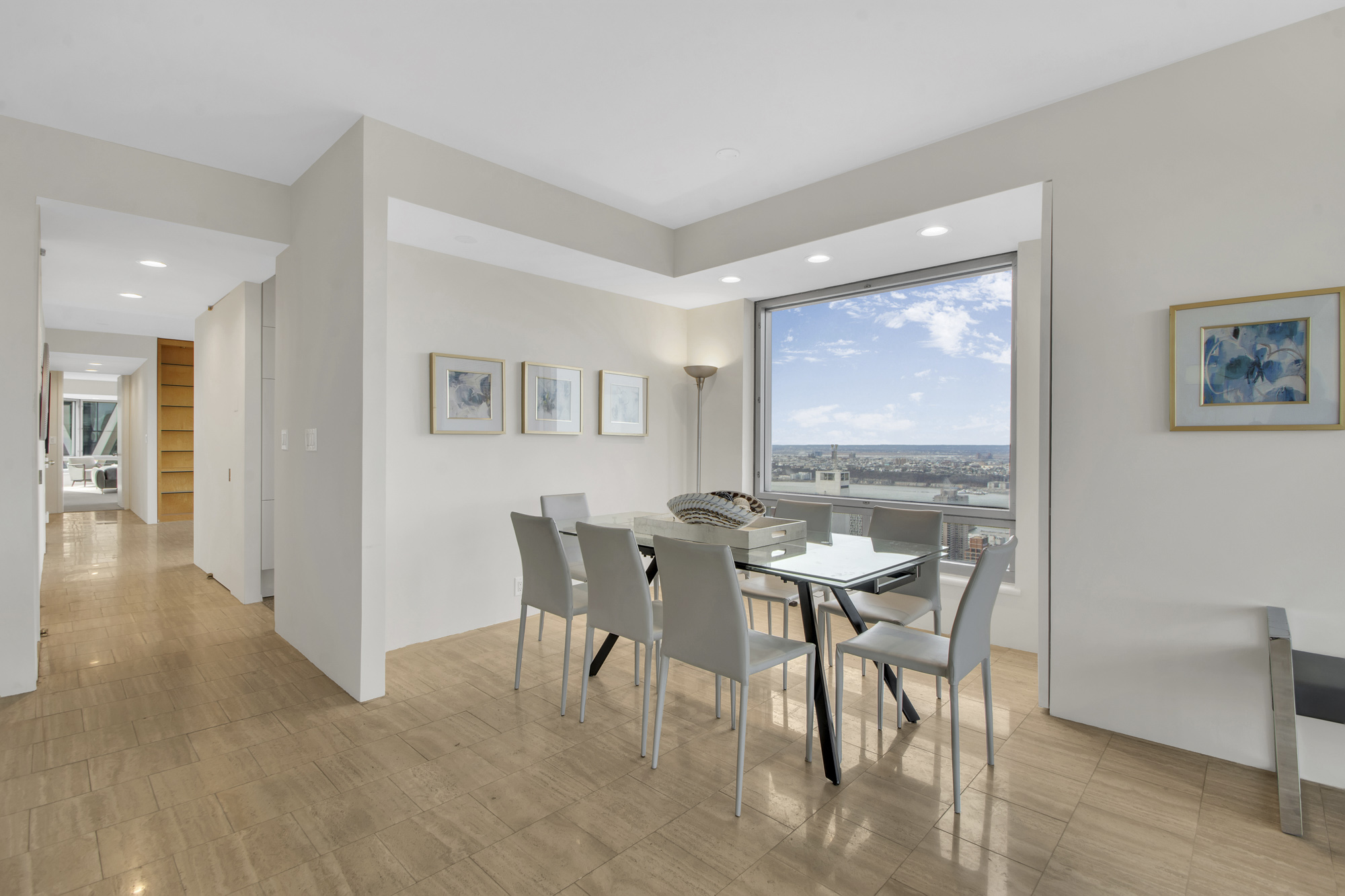 301 West 57th Street, Unit 48A Manhattan, NY 10019 - Photo 6 of 22 a view of a dining room with furniture and wooden floor