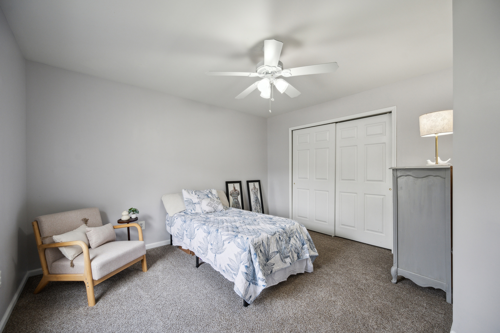 127 Hartman Road Pottstown, PA 19465 - Photo 22 of 42 a spacious bedroom with a bed and a chandelier